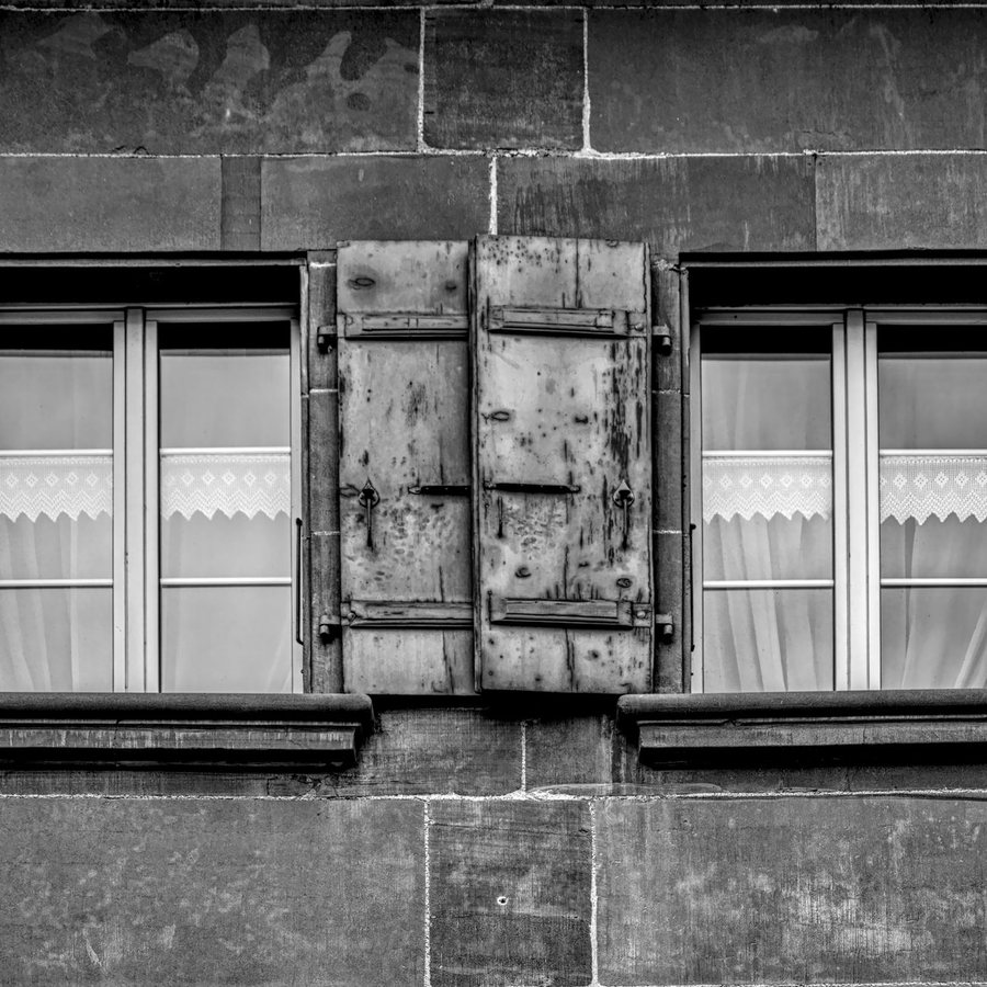 Sunlit workshop with wooden persiana slats and hand tools